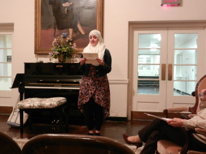 Hanna Al Hamdani reads poem during Multilingual Poetry Reading Event.