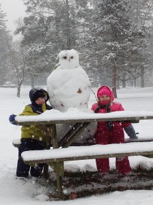 Brettney and Logan Marshall with Snow Man. Photo by Stephanie Marshall
