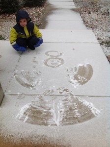 Logan Marshall age 7, makes a snow angel. Photo by Stephanie Marshall